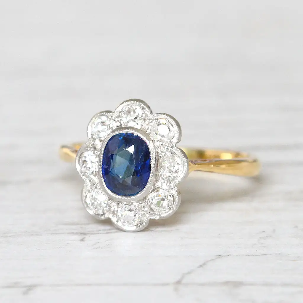 Edwardian 0.63 Carat Sapphire and Old Cut Diamond Cluster Ring